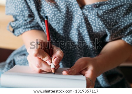 Female artist sketching. Learning to draw. Woman doing pencil sketch closeup.