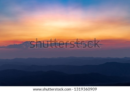 A beautiful colorful of sky and sunrise on the mountain
