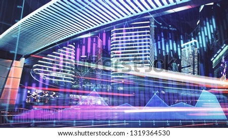 Trading graph on the cityscape at night background. Business and financial concept. Double exposure. Shanghai