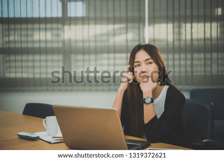 Asian businesswoman stress from hard work,Thai worker woman working in the office,Woman thinking concept