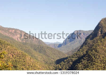Mountain layer and blue sky background.