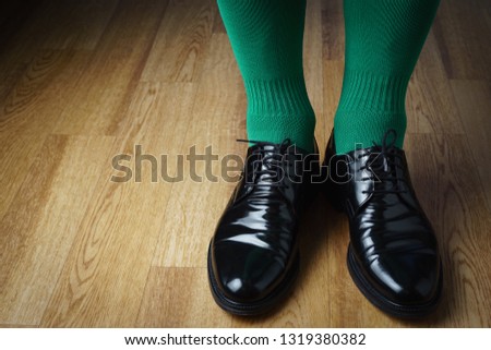 A man in green socks and shoes, St. Patrick's Day