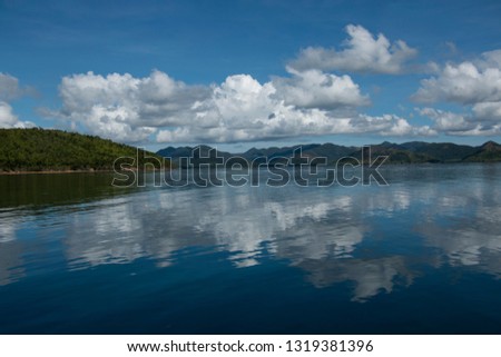 
clouds reflected in the paradisiacal sea of ​​the Coron island  in the Philippines