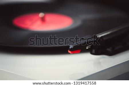 Retro turntable player needle.Play old vinyl records on turntables.Vintage hifi audio equipment in close up.