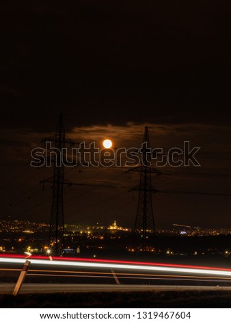 Full moon over the city. Full moon over Nitra city. Dark sky and full moon.
