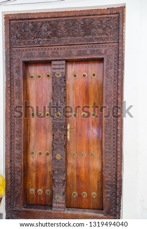 2018.02.24, Stone Town, Zanzibar, Tanzania. Travel around Africa. Authentic wooden door close up. Elements of national architecture in Africa.