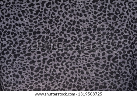 Leopard fabric pattern. Jaguar texture Background.