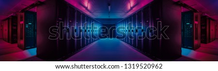 Wide-Angle Panorama Shot of a Working Data Center With Rows of Rack Servers. Red Emergency Led Lights Blinking and Computers are Working. Dark Ambient Light. Royalty-Free Stock Photo #1319520962