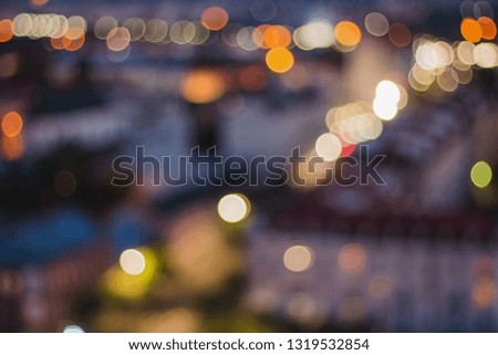 The lights of the night city. Blurred background. Abstract unfocused picture. Lanterns on the street.