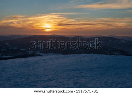 View from Babia Gora  Poland  Beskid Zywiecki winter sunny landscape. Sunset  View of the Tatra Mountains.