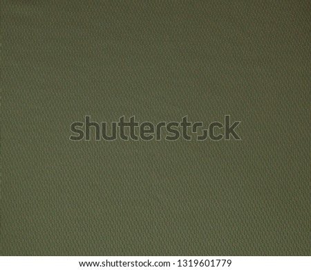 Dark green rough linen fabric texture close-up as background