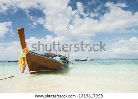 Long boat at beautiful beach of bamboo island near Phi Phi island in Krabi, Thailand.