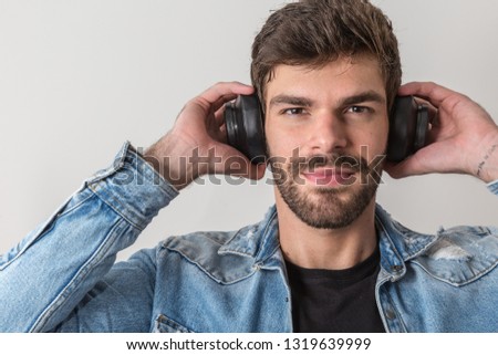 handsome man with his headphones listening to music