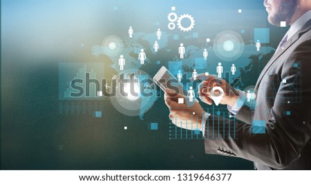 Business man with digital tablet and signs on background