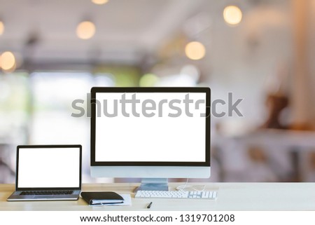 Monitor Mockup digital laptop and computer PC blank white screen on wood table at coffee shop