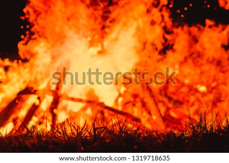big flames on field during fire