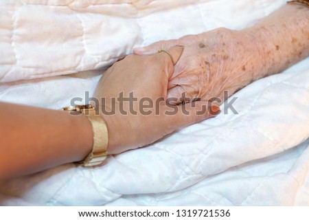 Close-up woman’s hand holding hand of the patient, Encouraging.