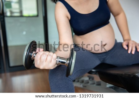 Pregnant woman in training