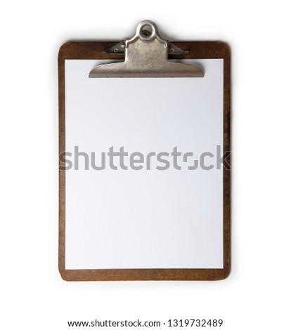 Vintage clipboard in high contrast. Old used clip board with blank piece of paper. Royalty-Free Stock Photo #1319732489