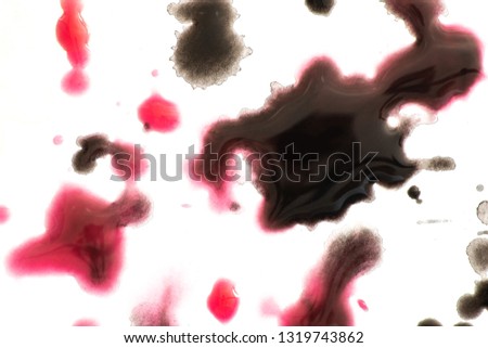 Abstract splash watercolor texture background. Close up macro detail. colorful painting. Red, black ink watercolor paint splash splatter on paper.