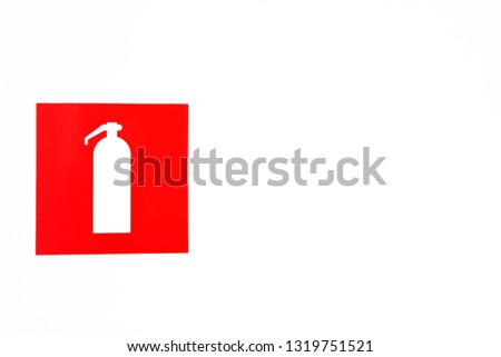 Red fire extinguisher poster on light background. Fire extinguisher sign stickers on white light wall