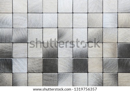 Silver, gray square mosaic tiles, metal texture background
