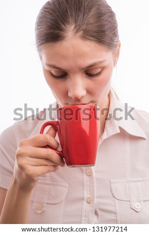 Beautiful young woman with a cup of tea/coffee