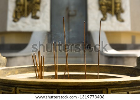 Incense sticks. Worship Buddha image.at Anolayo Thippayaram Temple.THAILAND