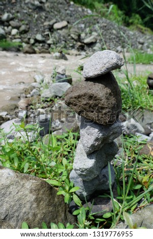 the art of stone balance on the river