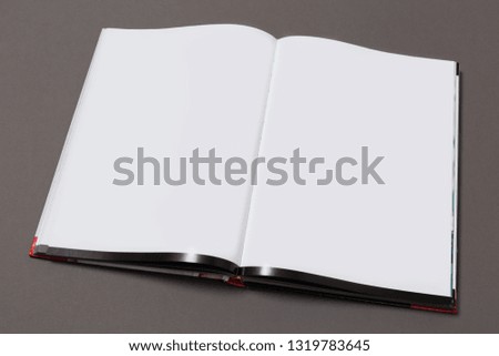 Mock-up magazine or catalog on gray background.Blank page or notepad for mockups or simulations. 