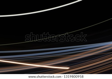 Vector image of colorful light trails with motion blur effect, long time exposure. Isolated on background 