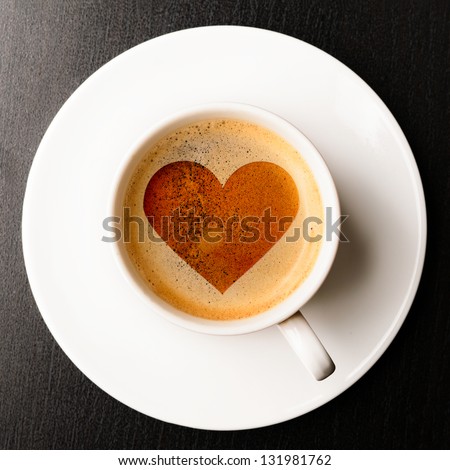 loving coffee. cup of fresh espresso with heart sign, view from above Royalty-Free Stock Photo #131981762