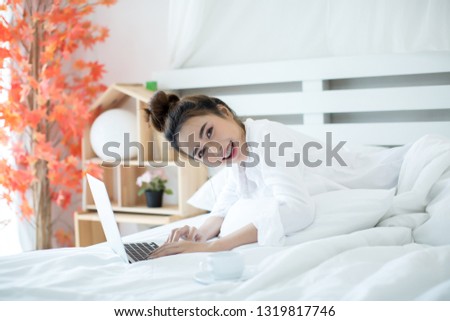woman on the bed in the house
