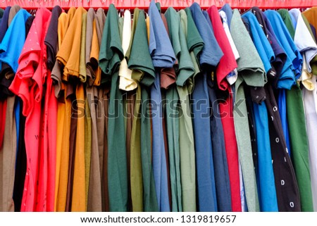 a group of colorful shirts Royalty-Free Stock Photo #1319819657