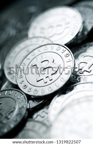 Bitcoins on a metal table.