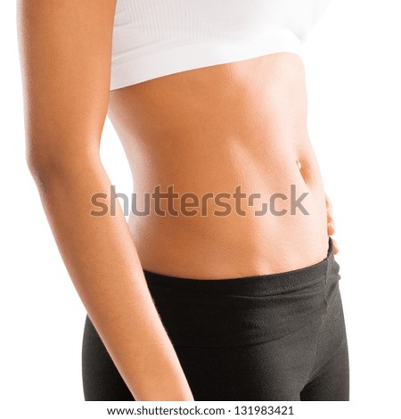 Abdomen of an Athletic Woman Over White Background