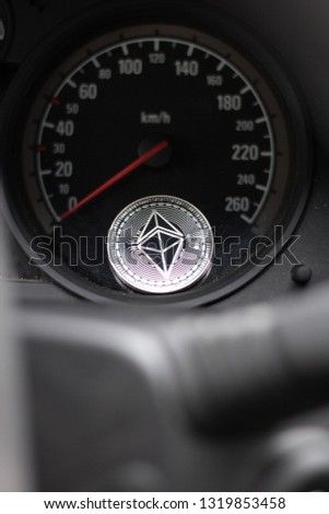 Ethereum Cryptocurrency Bitcoin Coin Car Speedometer, Photo through steering wheel, Crypto is picking up speed, selective focus