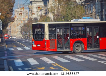 Public transportation / bus in urban surroundings on the street. Royalty-Free Stock Photo #1319858627