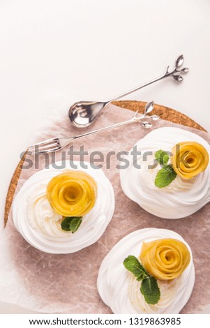 Light festive pavlova dessert made from meringue, lemon kurt and whipped cream