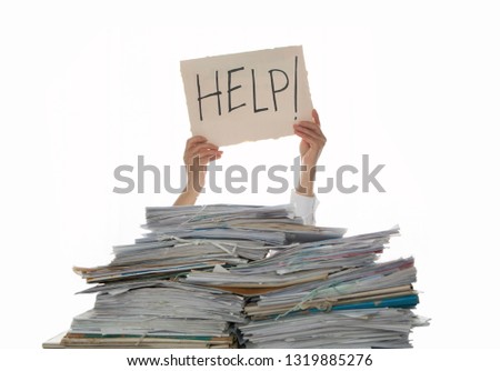 Person under a pile of papers with a hand holding a sign of help. Accounting. 