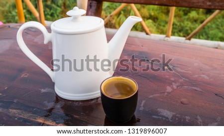 Tea pot and tea cup on wood still life art 