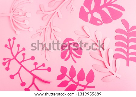 Bright pink leaves of paper on light pink