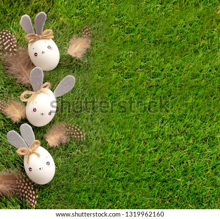 Easter decoration for home, handmade work, cute eggshell rabbits over green grass, beautiful background for card design