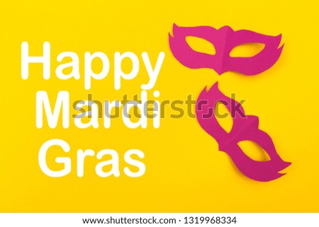 cut out colored paper figures for the holiday Mardi Gras, colour background