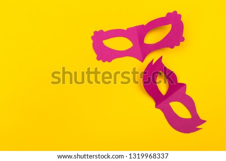 cut out colored paper figures for the holiday Mardi Gras, colour background