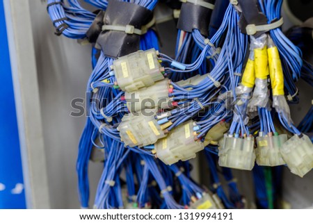 The background of the electronic equipment set (power cord, plug), inside the elevator kit, for machine improvement, to be able to use again.