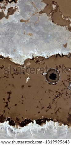muddy eye, black gold, polluted desert sand, tribute to Pollock, vertical abstract photography of the deserts of Africa from the air, aerial view, abstract expressionism, abstract naturalism.