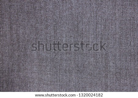 Dark grey texture background of empty seamless cloth pattern. Simple blank backdrop of grey color material to use as templae, banner or frame