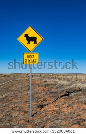 An animal warning sign on a road, in rural New Mexico