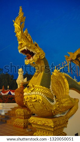 Statue of King of Nagas on clear blue sky background. Serpent statue.heads of Serpent .
